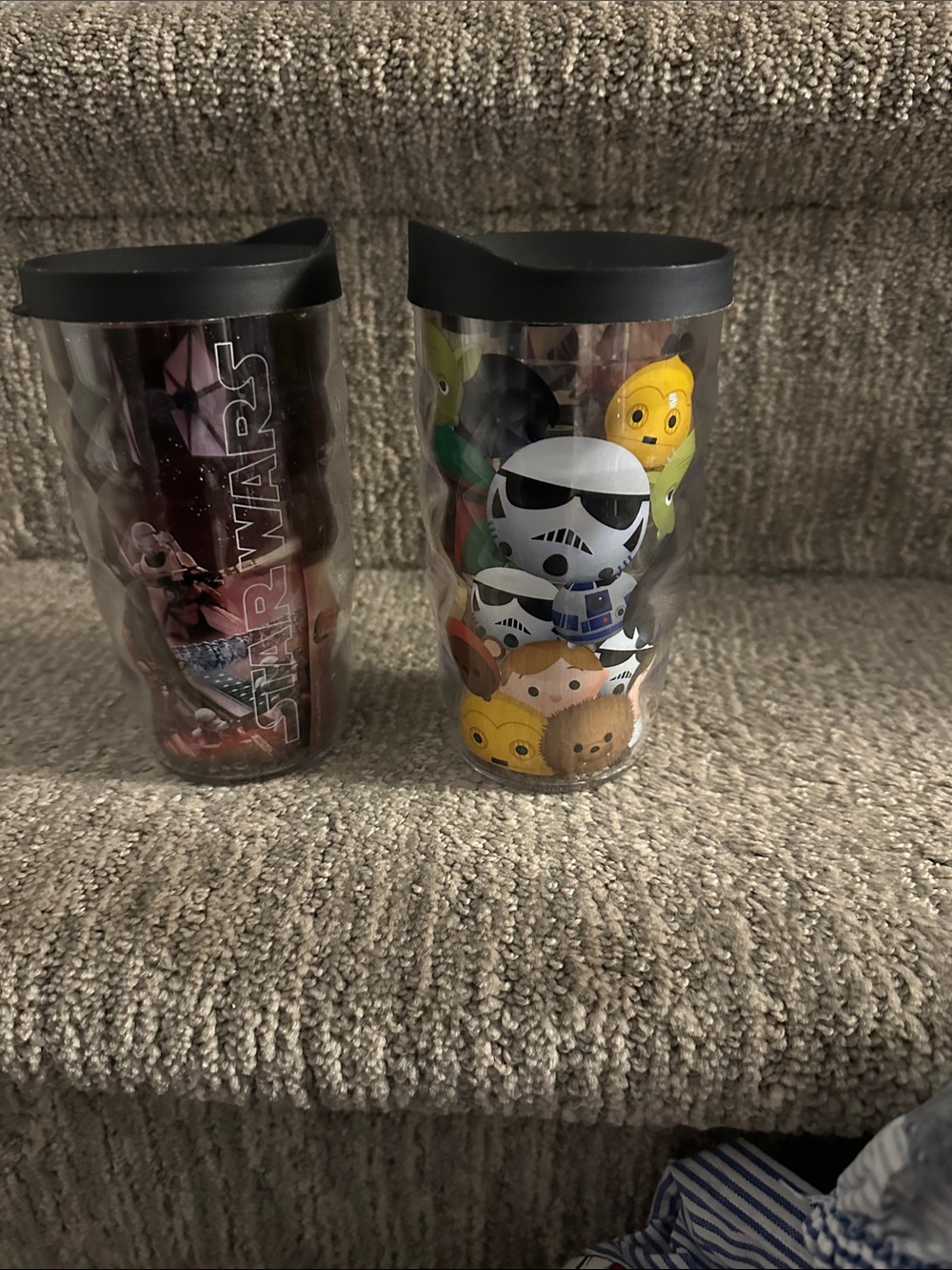 Pair of Tervis Star Wars travel tumbler with a black lid.